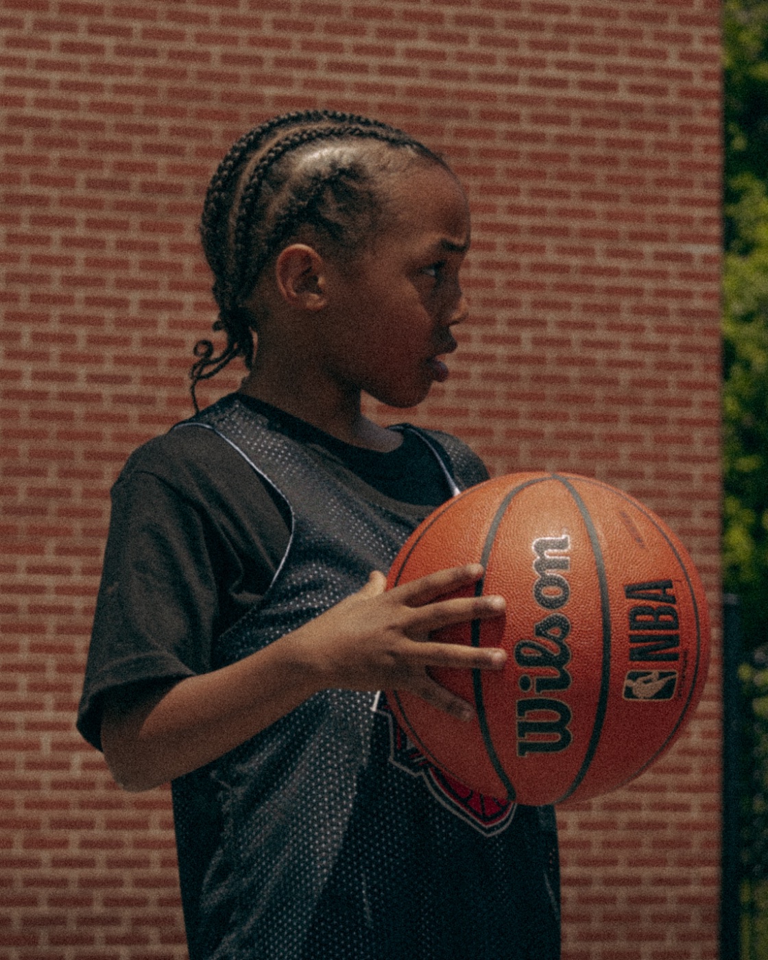 A young London LOGIC athlete gripping the ball, locked in
