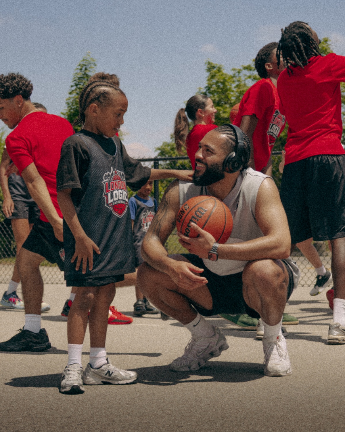 Coach AD sharing a moment with a young athlete at camp